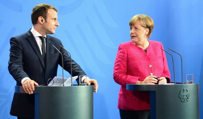 Президент Франції Еммануель Макрон і канцлер Німеччини Ангела Меркель. Фото з сайту www.ukrinform.ua